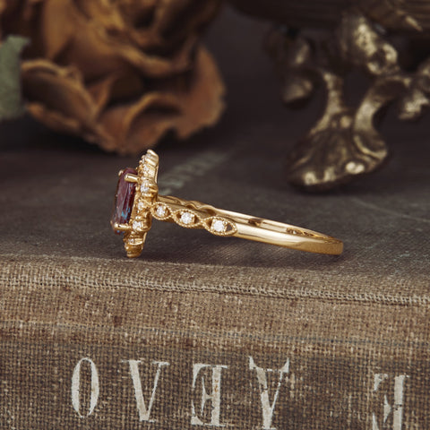 Elegant side view of oval Alexandrite ring with moissanite, featuring a twisted band.